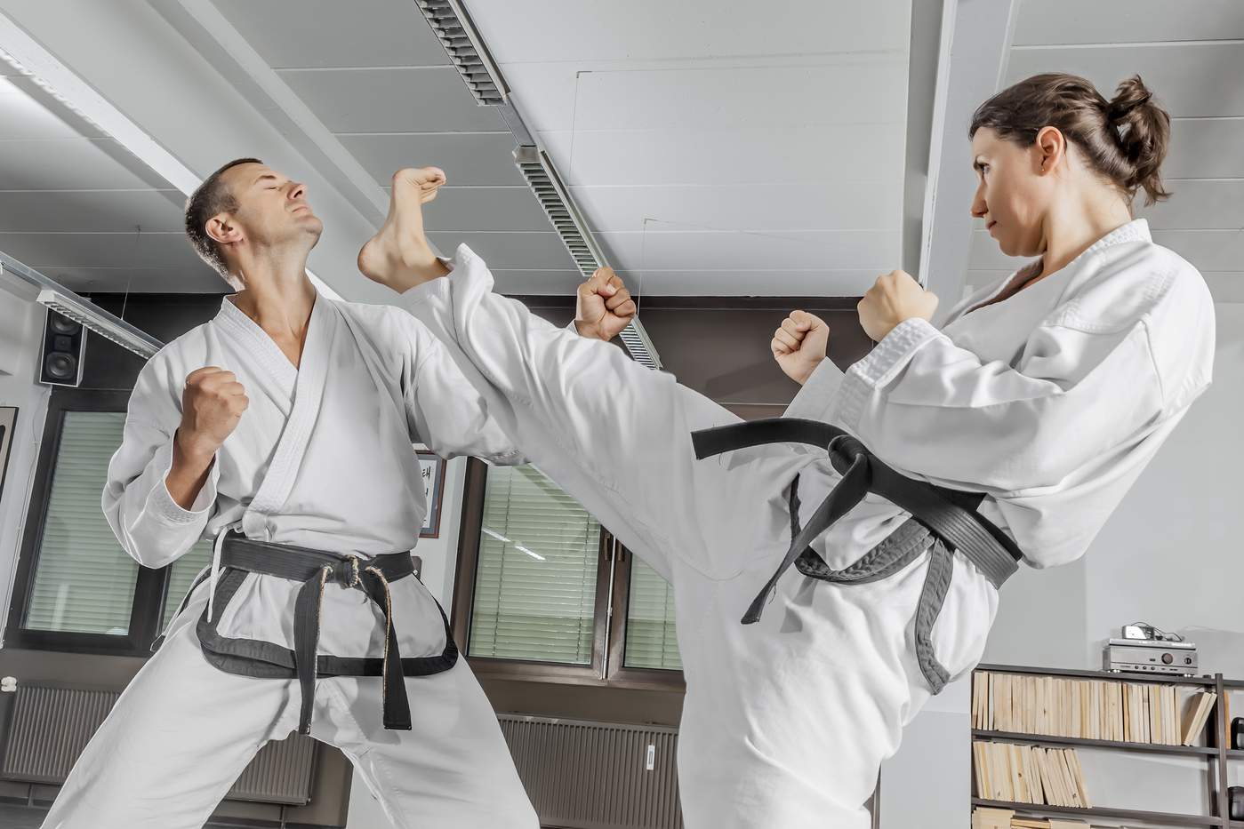 Female karate expert practicing self defense moves